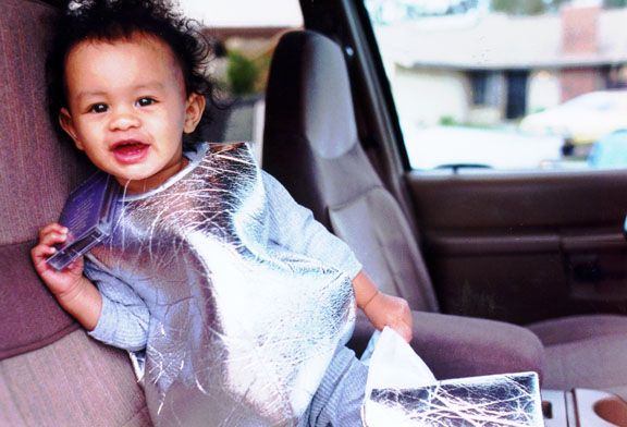 Mari plays in mom's new car