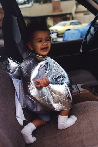 Mari plays in mom's new car