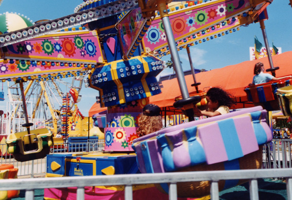 Mari rides flying teacups with Amber!