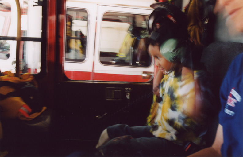 Mari puts on headphones in the fire engine!