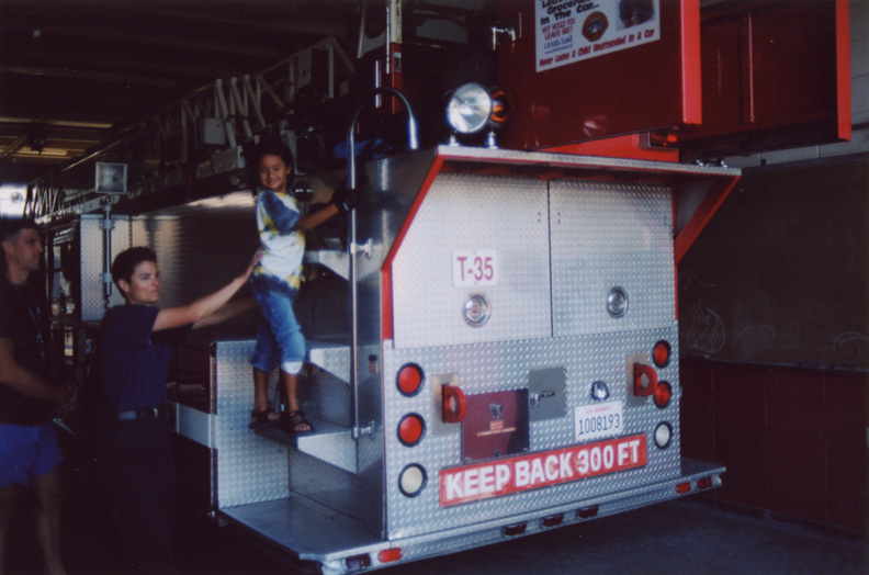 Mari climbs the fire engine!