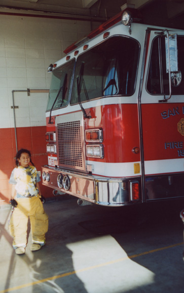 Mari tries on fire fighting pants!