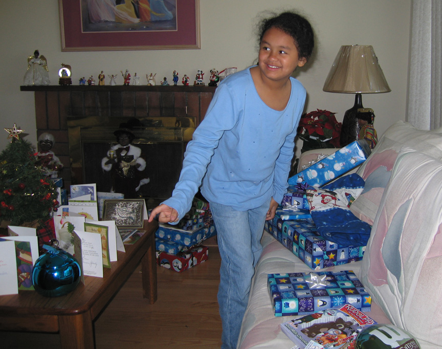 Mari can't decide which present to open next!
