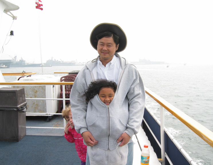 Mari keeps warm with her daddy!