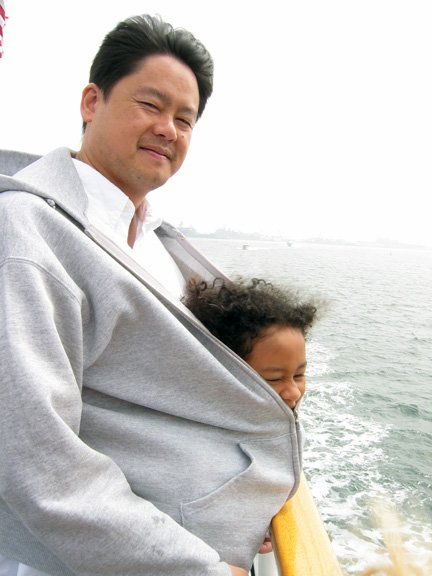 Mari keeps warm with her daddy!
