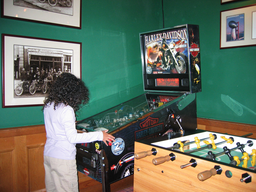 Mari plays her last game of pinball in the hotel restaurant!