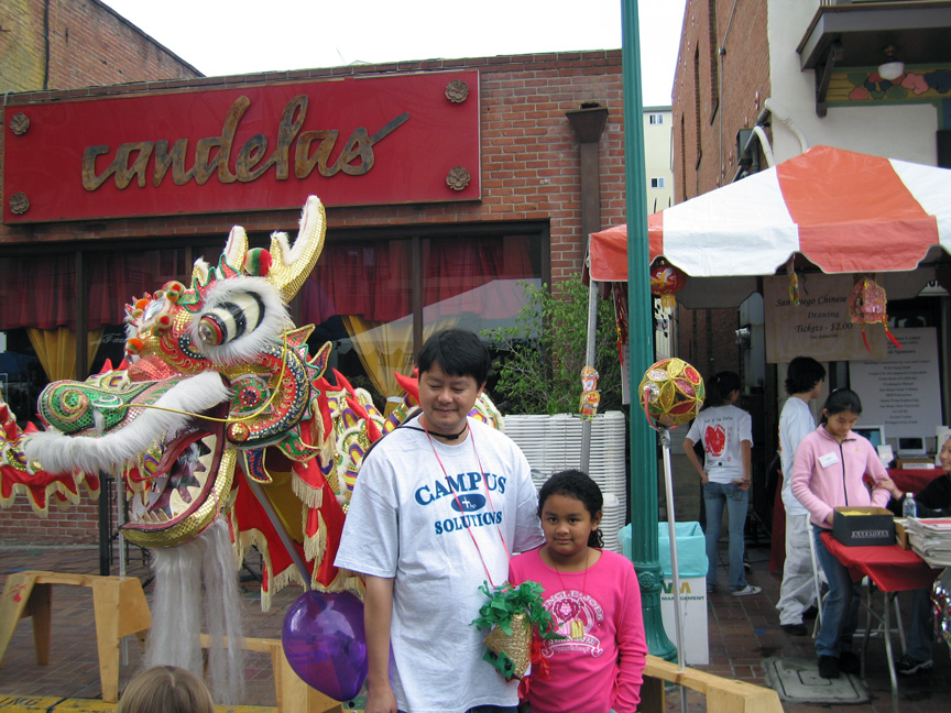Mari and daddy check out the dragon!