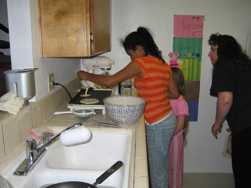 Mari makes pancakes at Maggie's house for the first time!