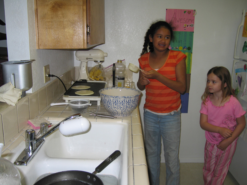 Mari makes pancakes at Maggie's house for the first time!