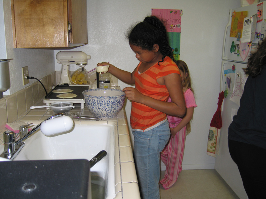 Mari makes pancakes at Maggie's house for the first time!